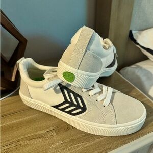 White and Black Sneakers with Green Accent